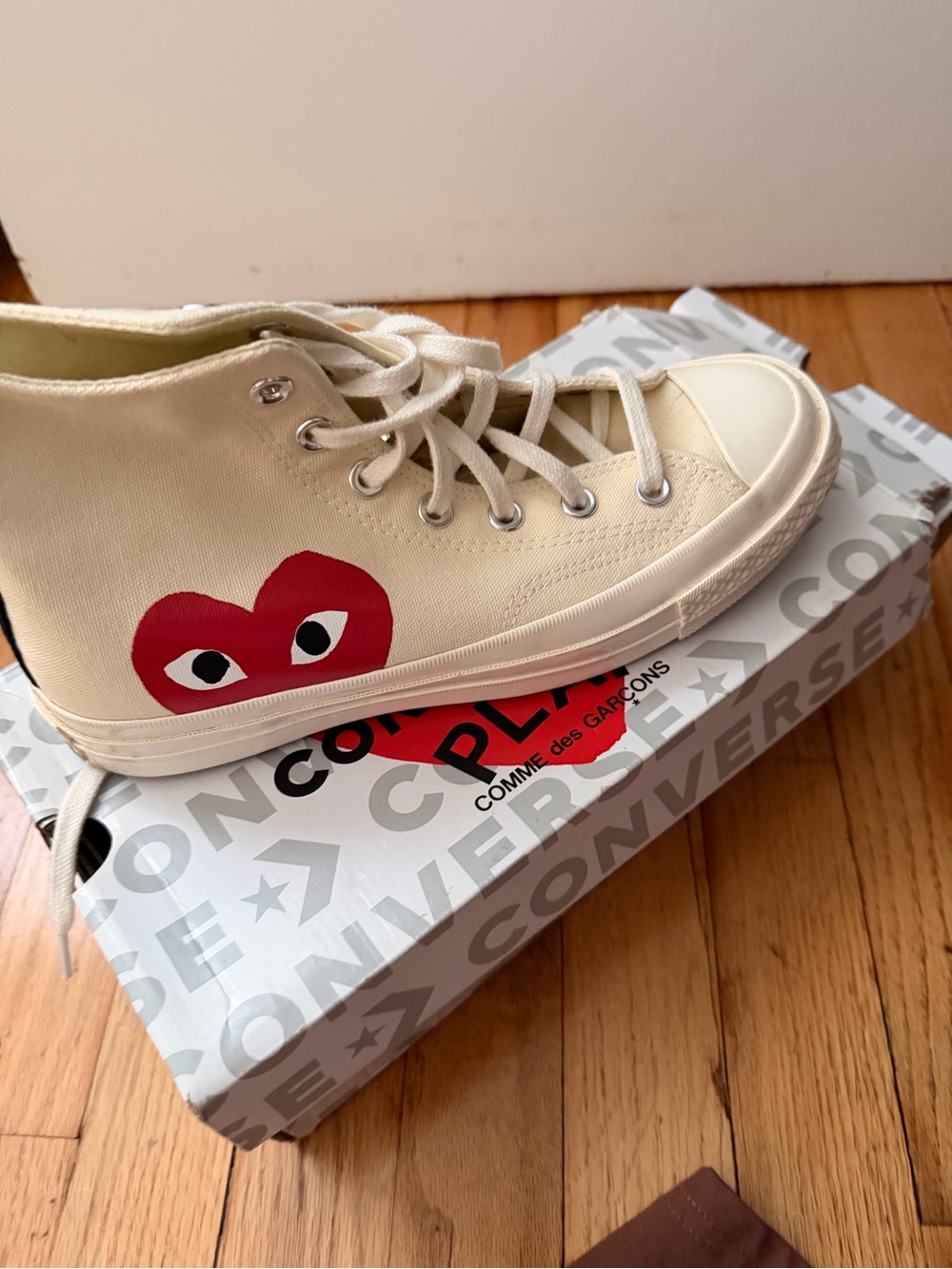 Converse Comme des Garcons High-Top Sneaker in Cream. Woman’s 8/Mens 6